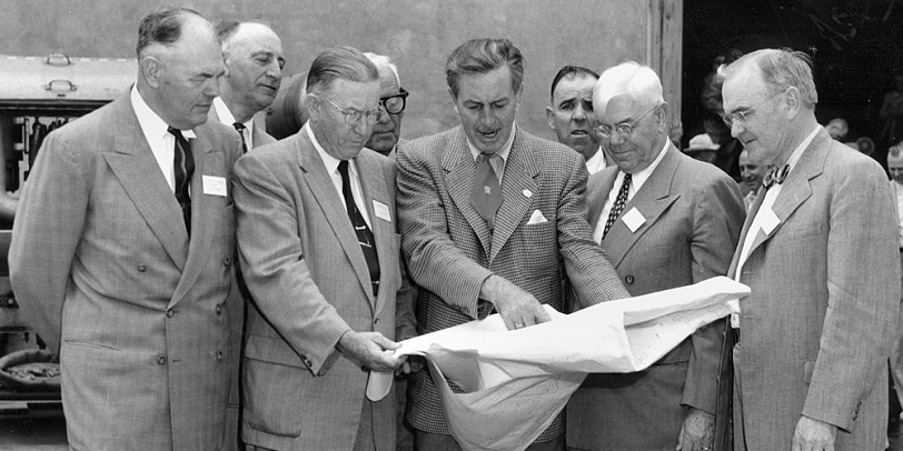 Walt Disney shows Disneyland plans to Orange County officials in December 1954. Photo Courtesy: Orange County Archives (CC BY 2.0)