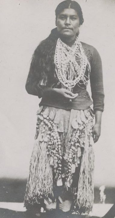 Shows Mrs. Thompson in native dress. Handwritten on verso -- "This picture was taken on a Tin Tipe plate the day after my marriage to M. J. Thompson Indian Law and from the tin tipe to this photograph and from this to the picture in my book