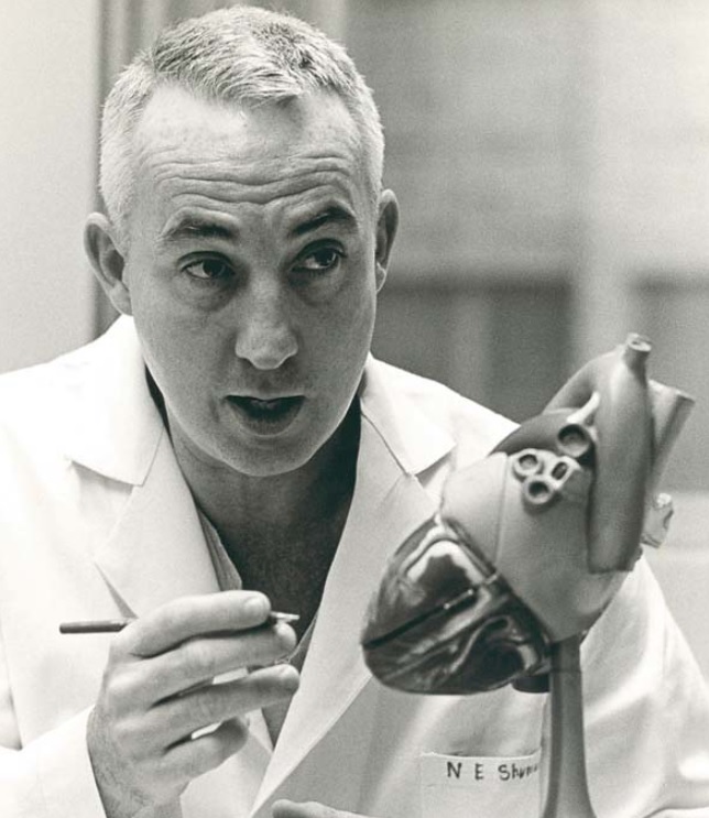 Dr. Norman Shumway with a model of the human heart