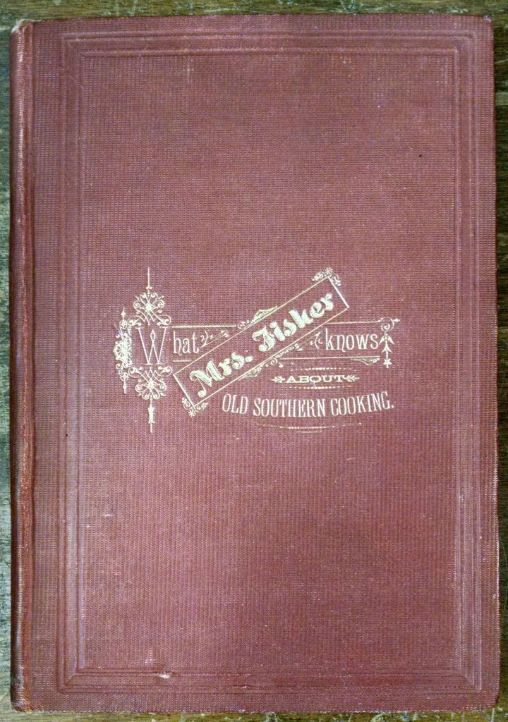 Shows a red book cover bearing the title "What Mrs. Fisher knows About Old Southern Cooking"