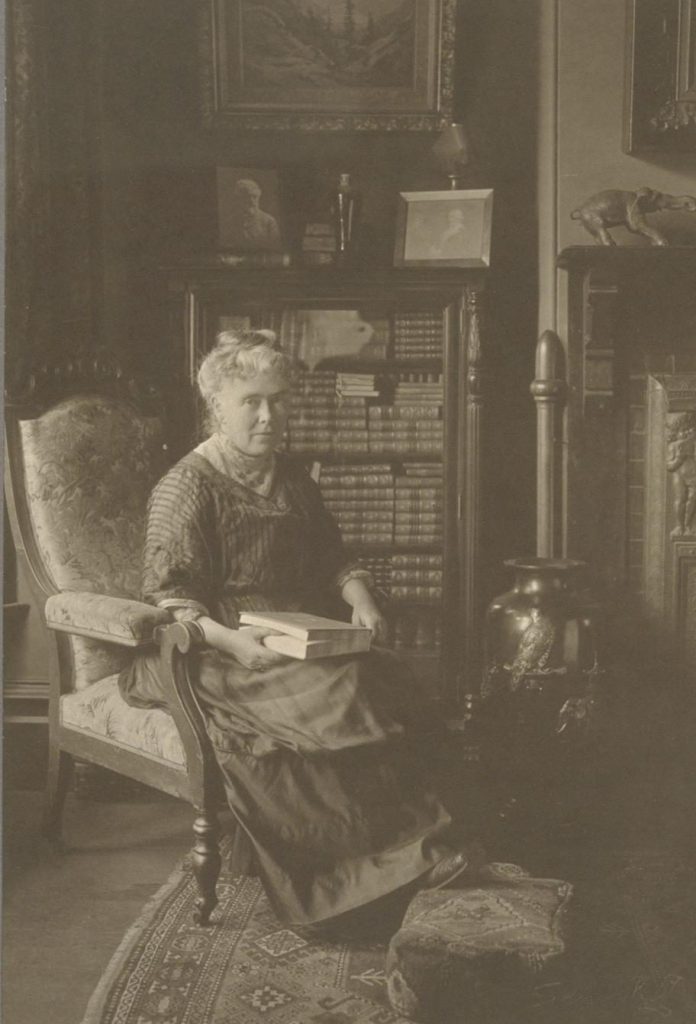 A portrait of Mary McHenry Keith seated in her parlor, 2207 Atherton St.